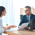 Lawyer and client working on paperwork