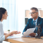 Lawyer and client working on paperwork