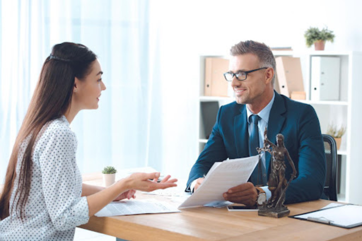 Lawyer and client working on paperwork