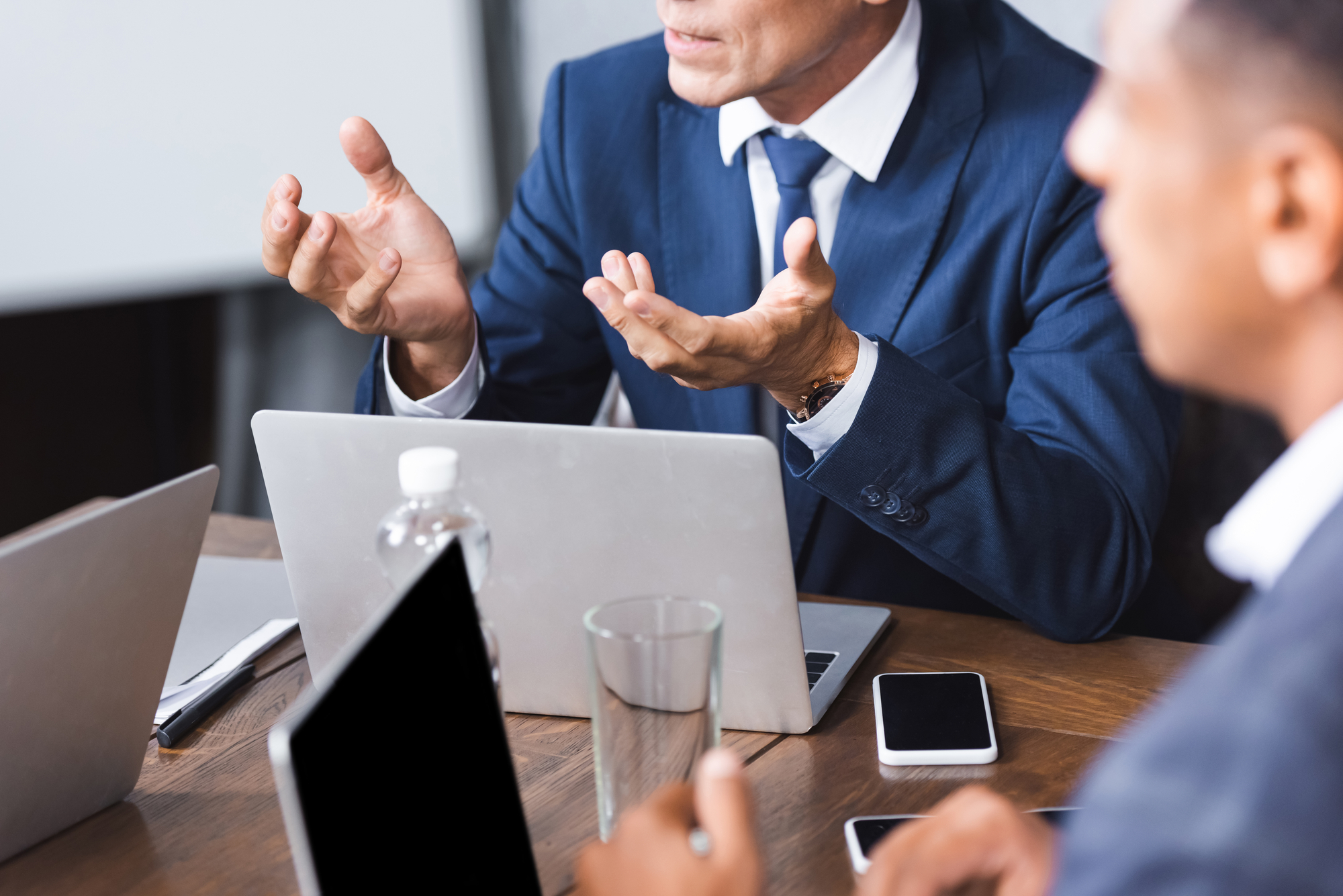 Men-at-table-with-hands
